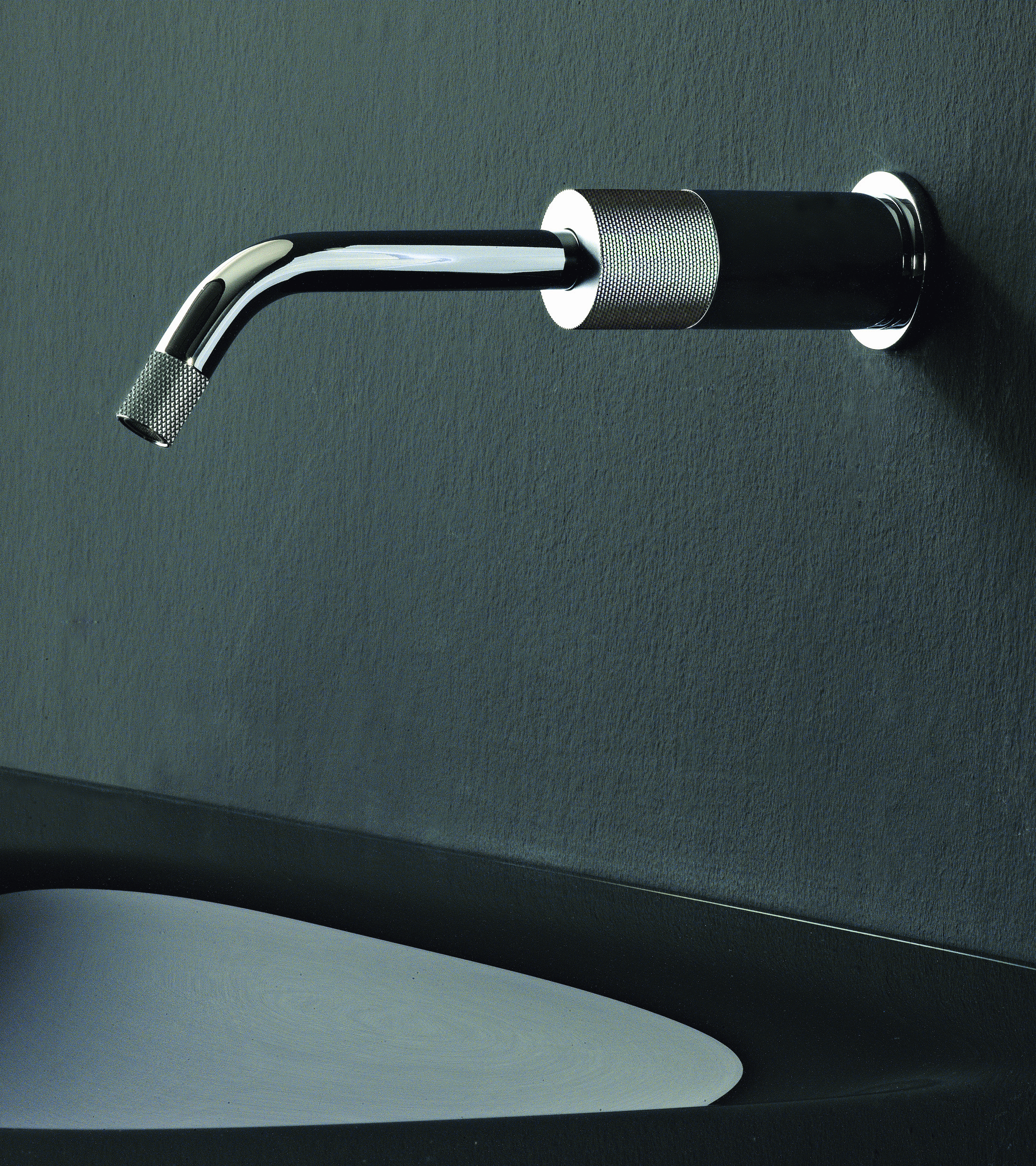 Watermark Titanium 22 with textured handles and streamlined single-lever monoblock units to bring a classic, industrial feel.